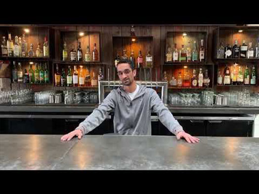 man standing in the bar counter