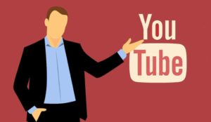 Man pointing at YouTube Logo