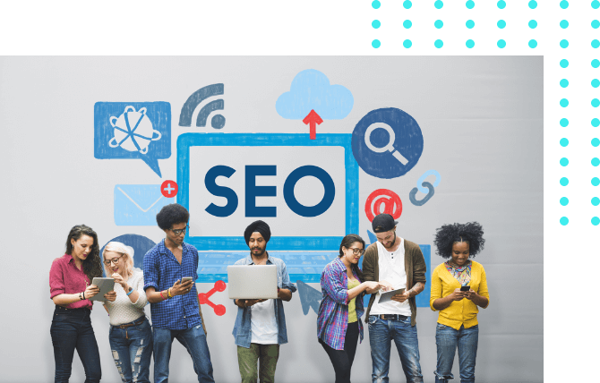 Seven people with gadgets standing in front of a wall with SEO word painted